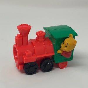 Winnie the Pooh toy on train Big Thunder Mountain